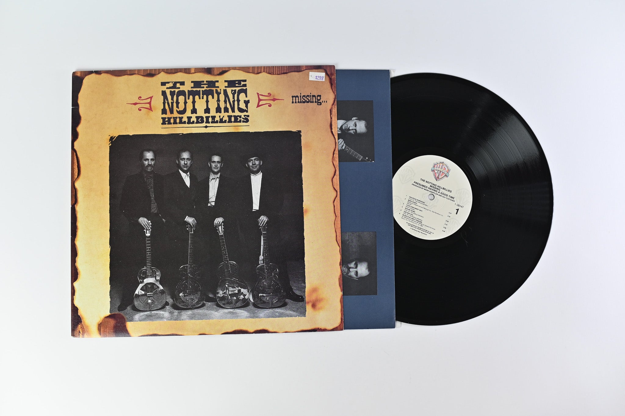 The Notting Hillbillies - Missing... Presumed Having A Good Time on Warner Bros. Records