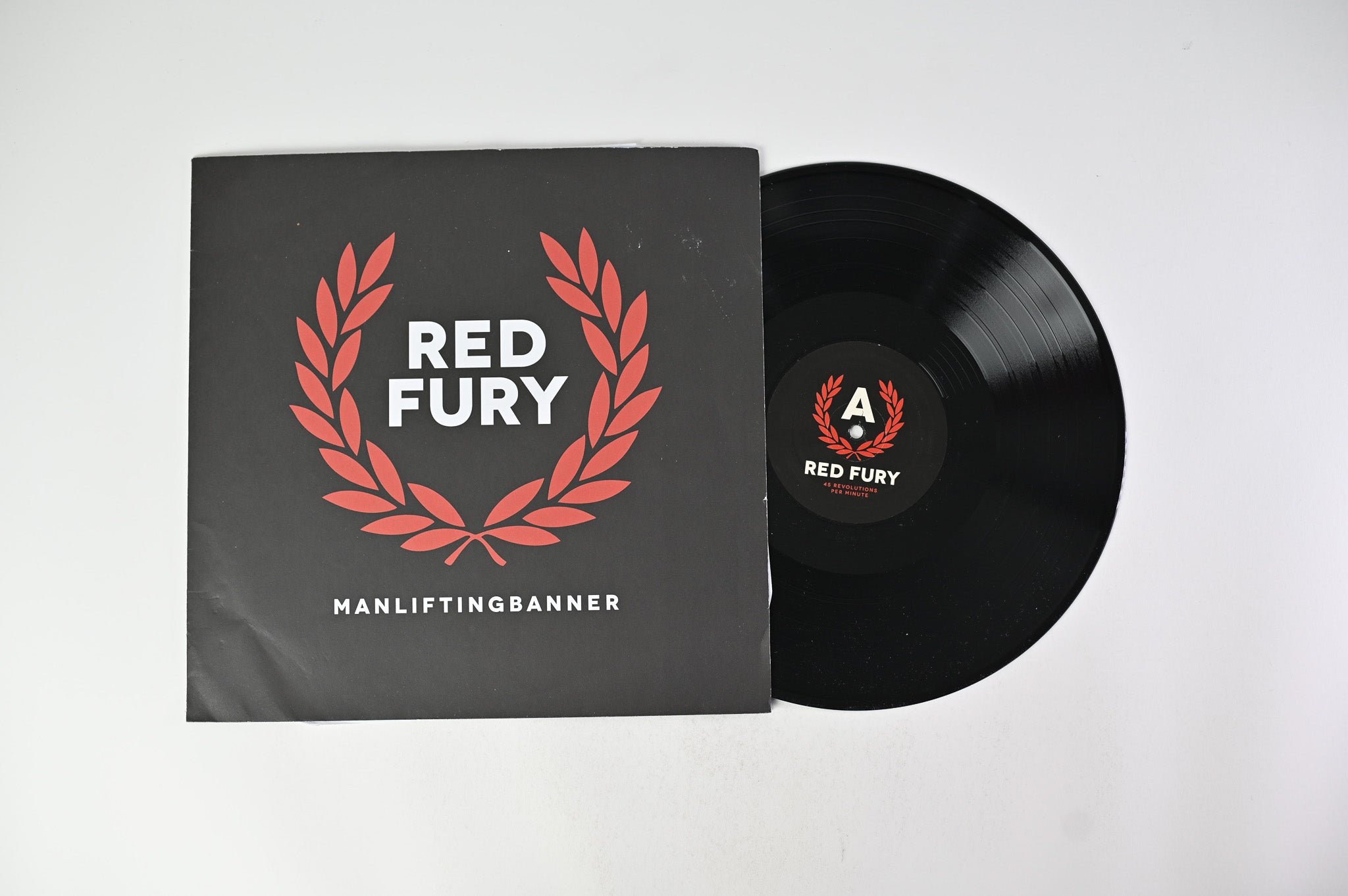 Man Lifting Banner - Red Fury on Crucial Response Records