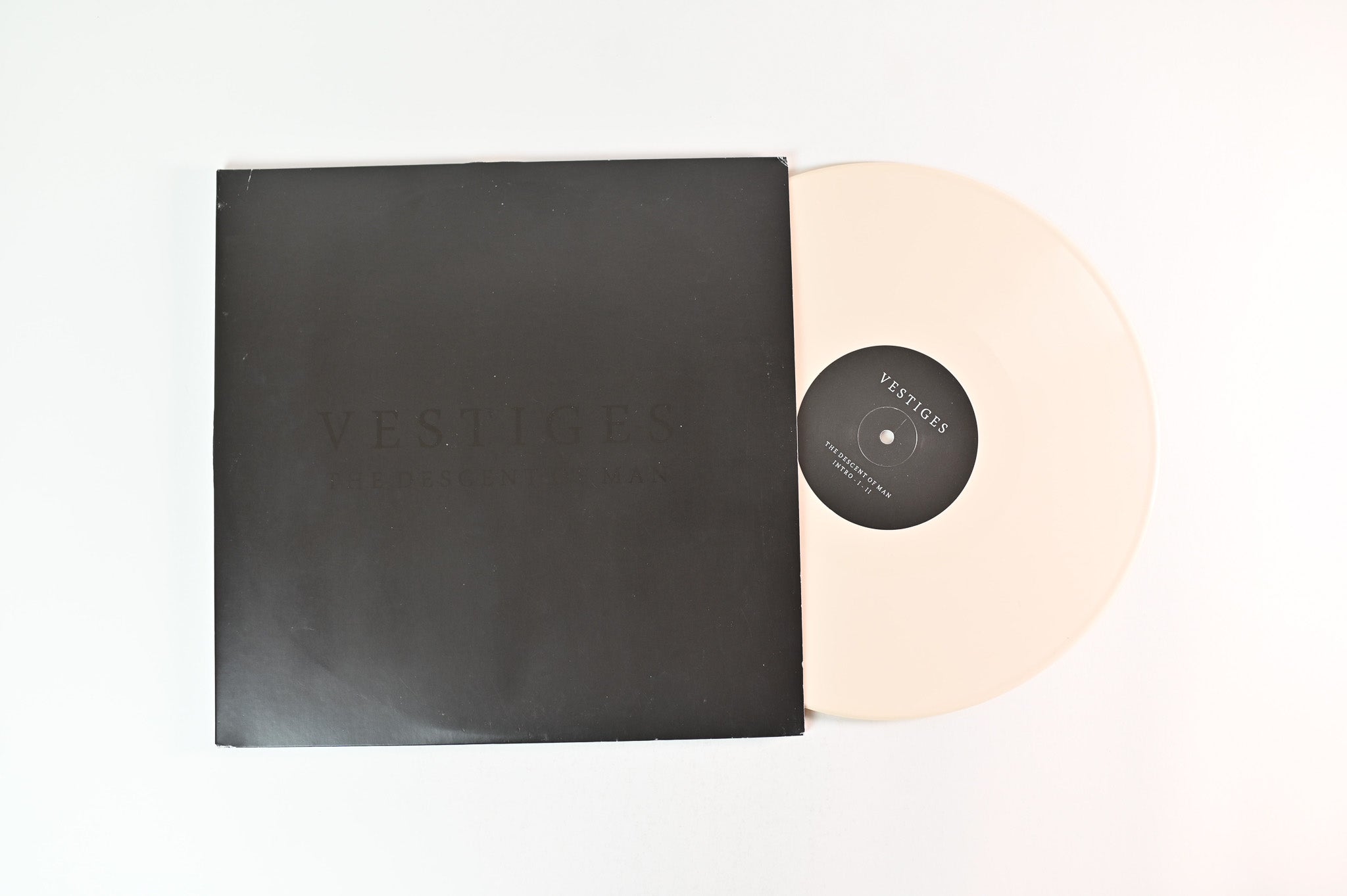 Vestiges - The Descent Of Man on Replenish Ltd Bone Vinyl With Screenprinted D-Side Reissue