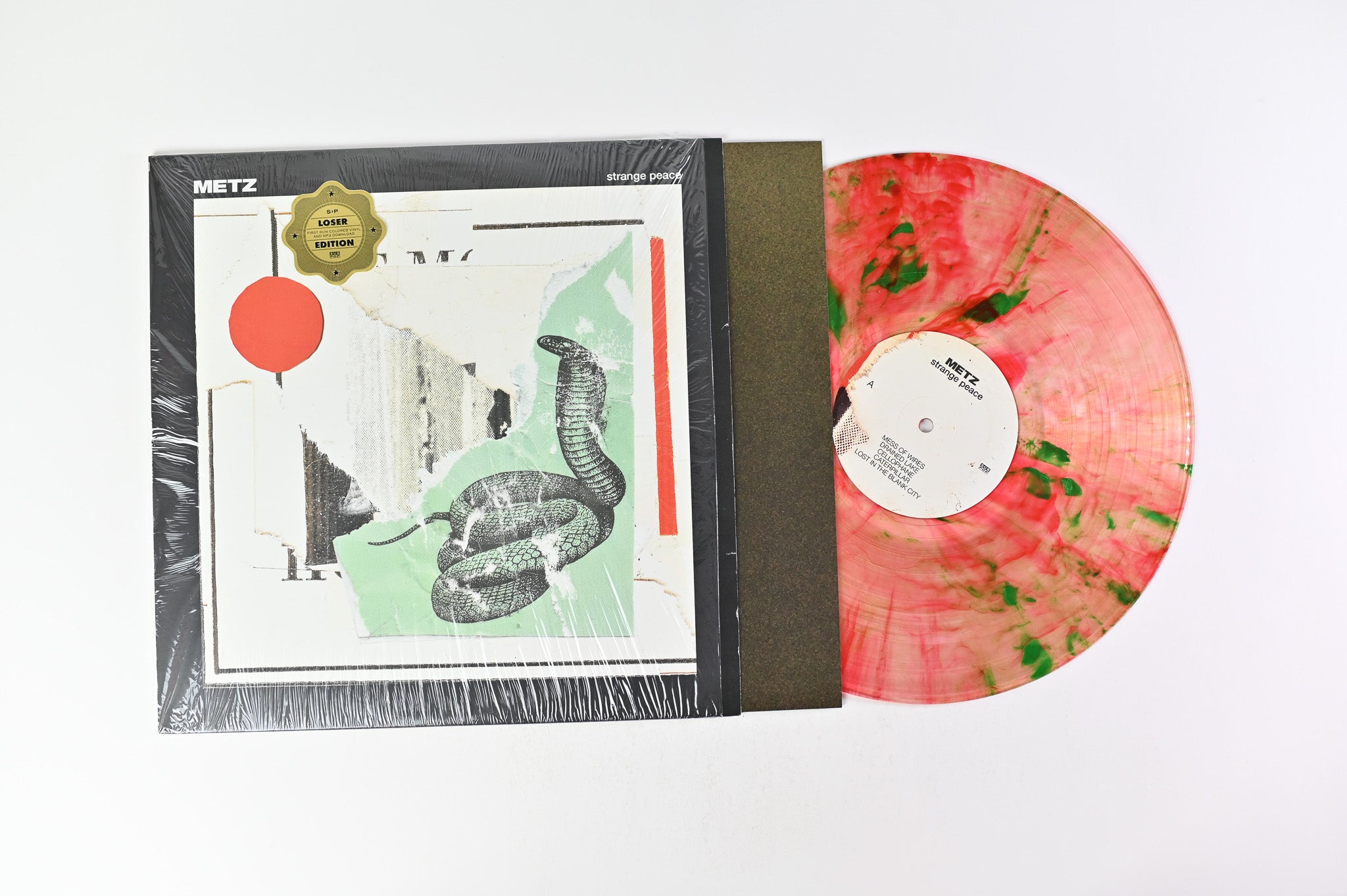 Metz - Strange Peace on Sub Pop - Clear With Red And Green Swirl Vinyl