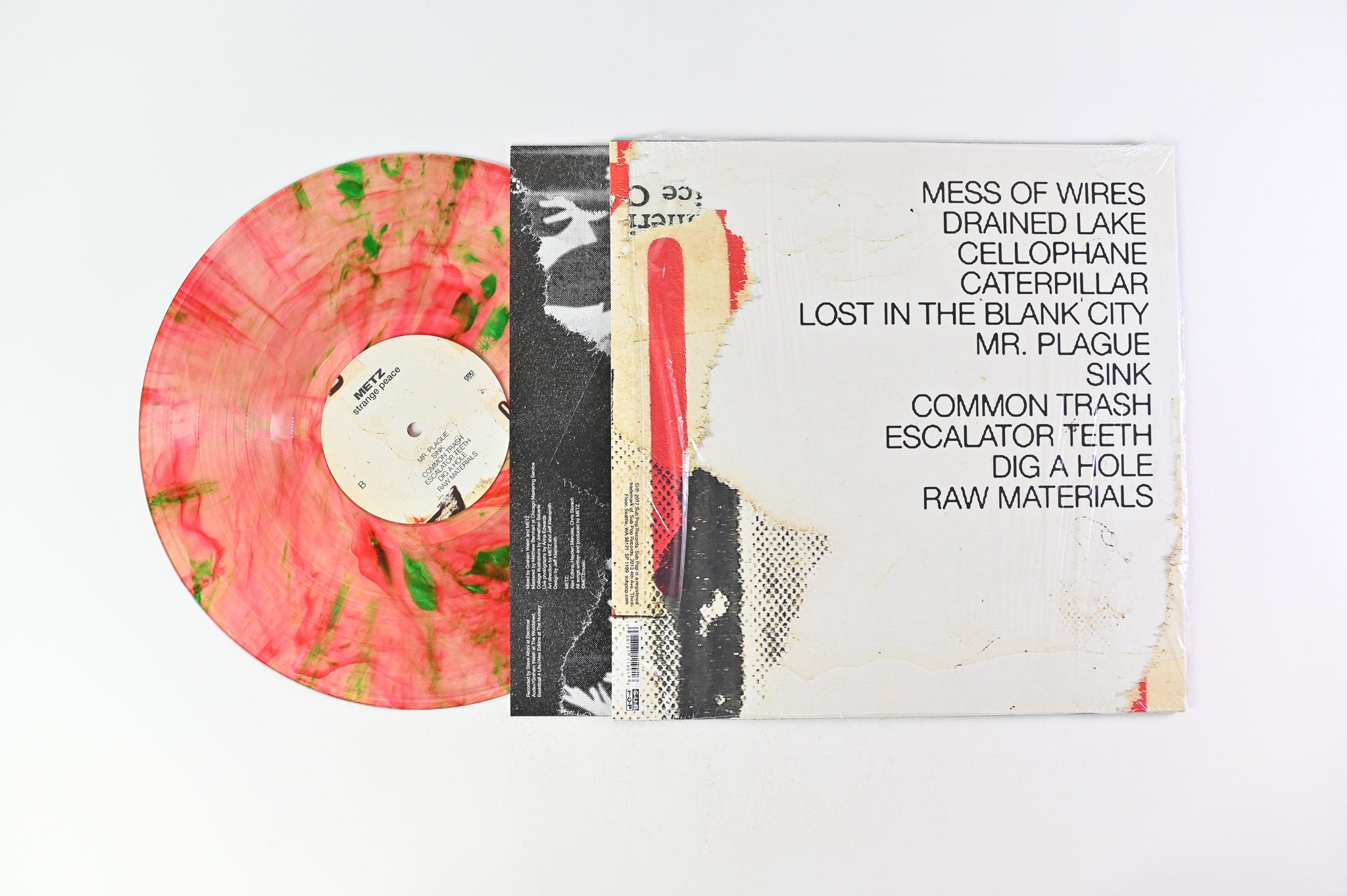 Metz - Strange Peace on Sub Pop - Clear With Red And Green Swirl Vinyl