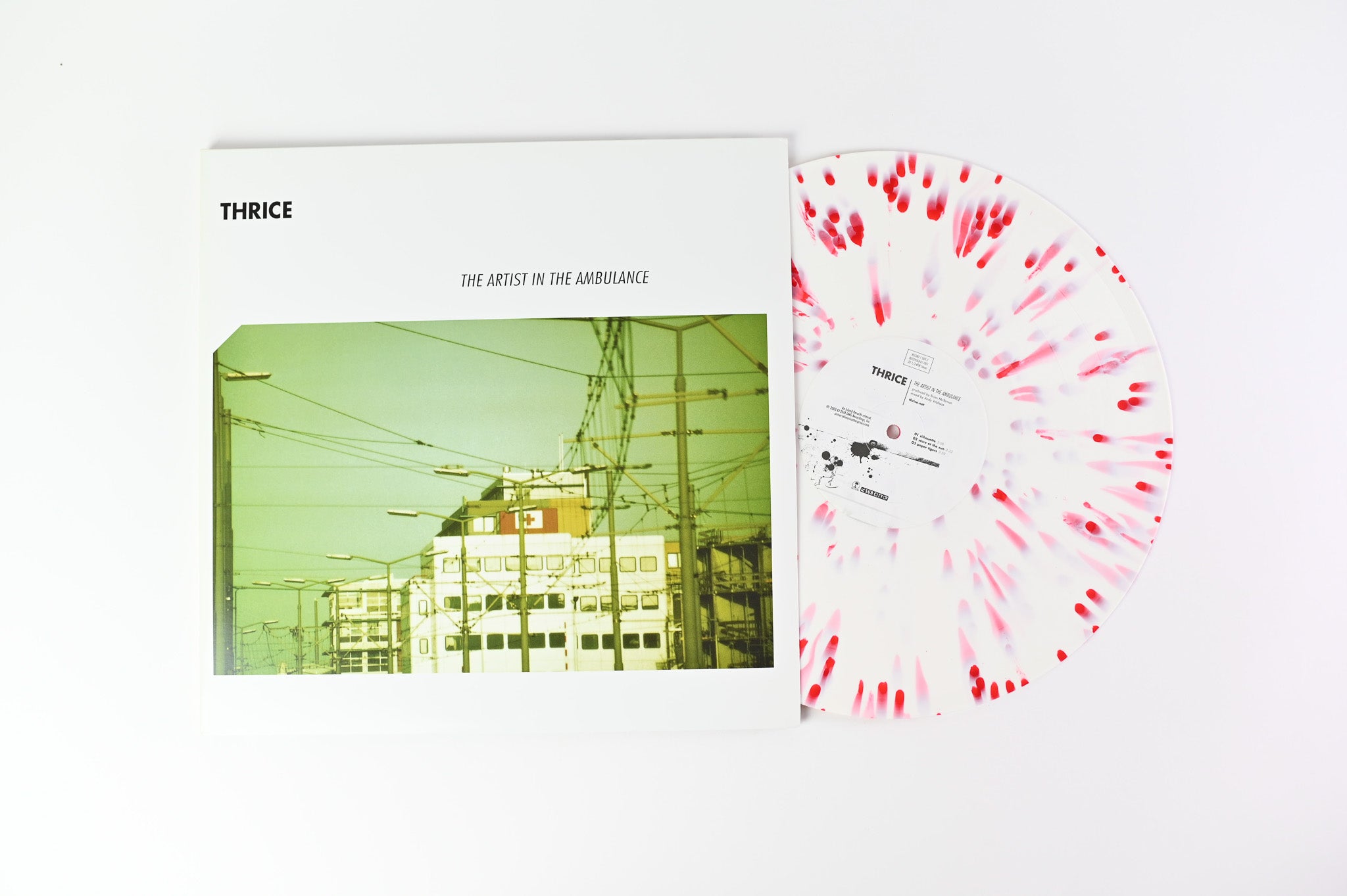 Thrice - The Artist In The Ambulance on Island Ltd White with Red Splatter Reissue